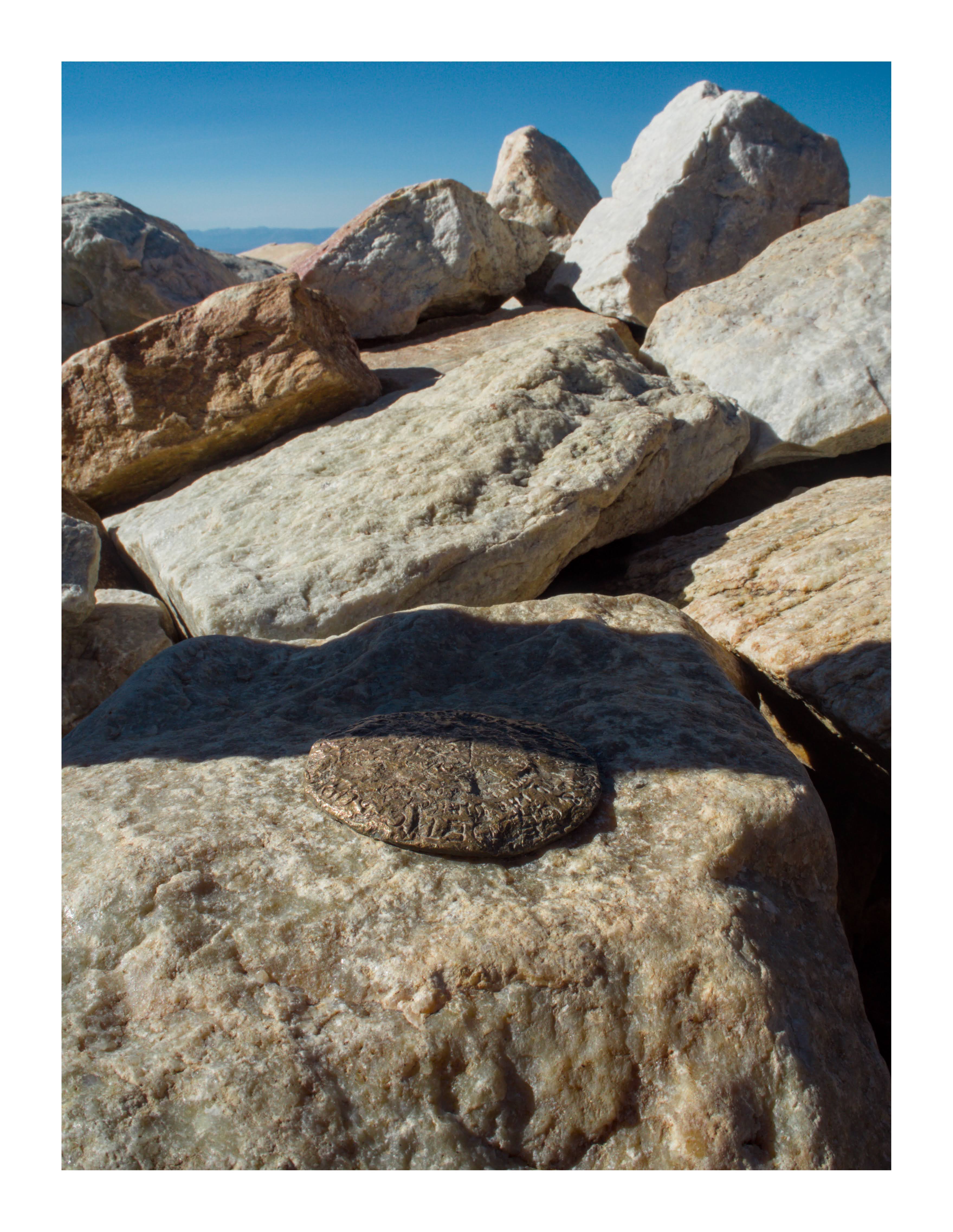 A battered USGS Survey Monument at the Medicine Bow Peak summit
